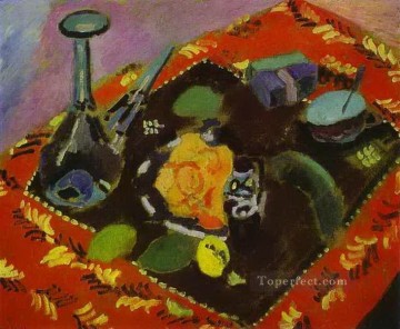 アンリ・マティス Painting - 赤と黒の絨毯の上の料理と果物 1906 年抽象フォービズム アンリ・マティス